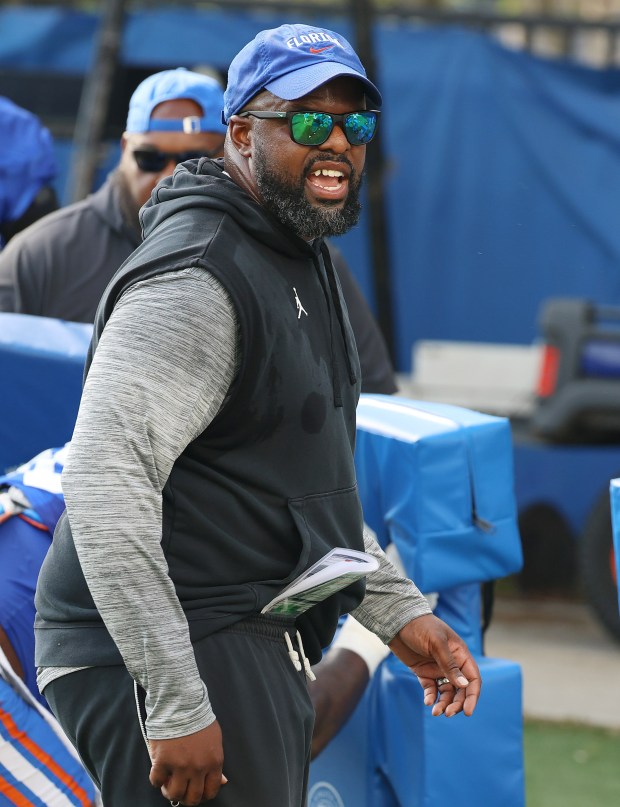University of Florida assistant football coach Gerald Chatman coaches players during practice on the UF campus in Gainesville on Tuesday, April 2, 2024. (Stephen M. Dowell/Orlando Sentinel)
