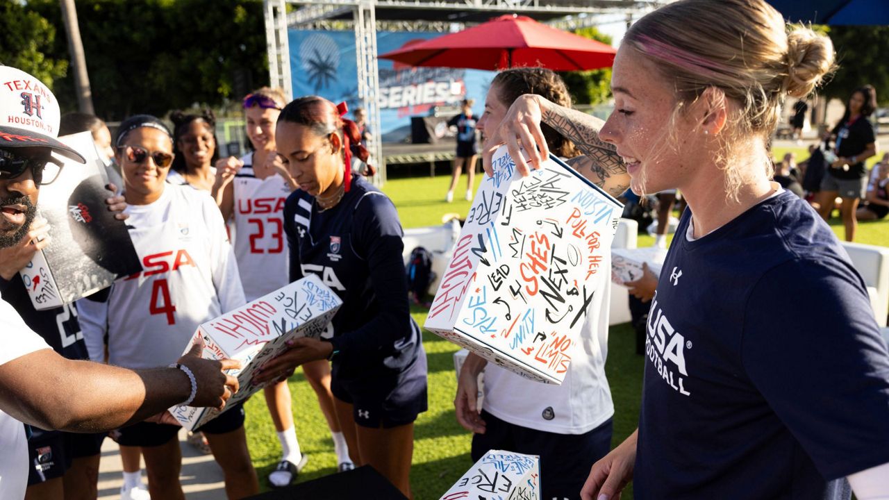 U.S. Flag National Team members unbox She’s Next gear from the Houston Texans and foundation vice president Hannah McNair, on June 18, 2025, in Carson, Calif. (Hanna Yamamoto/Houston Texans via AP)