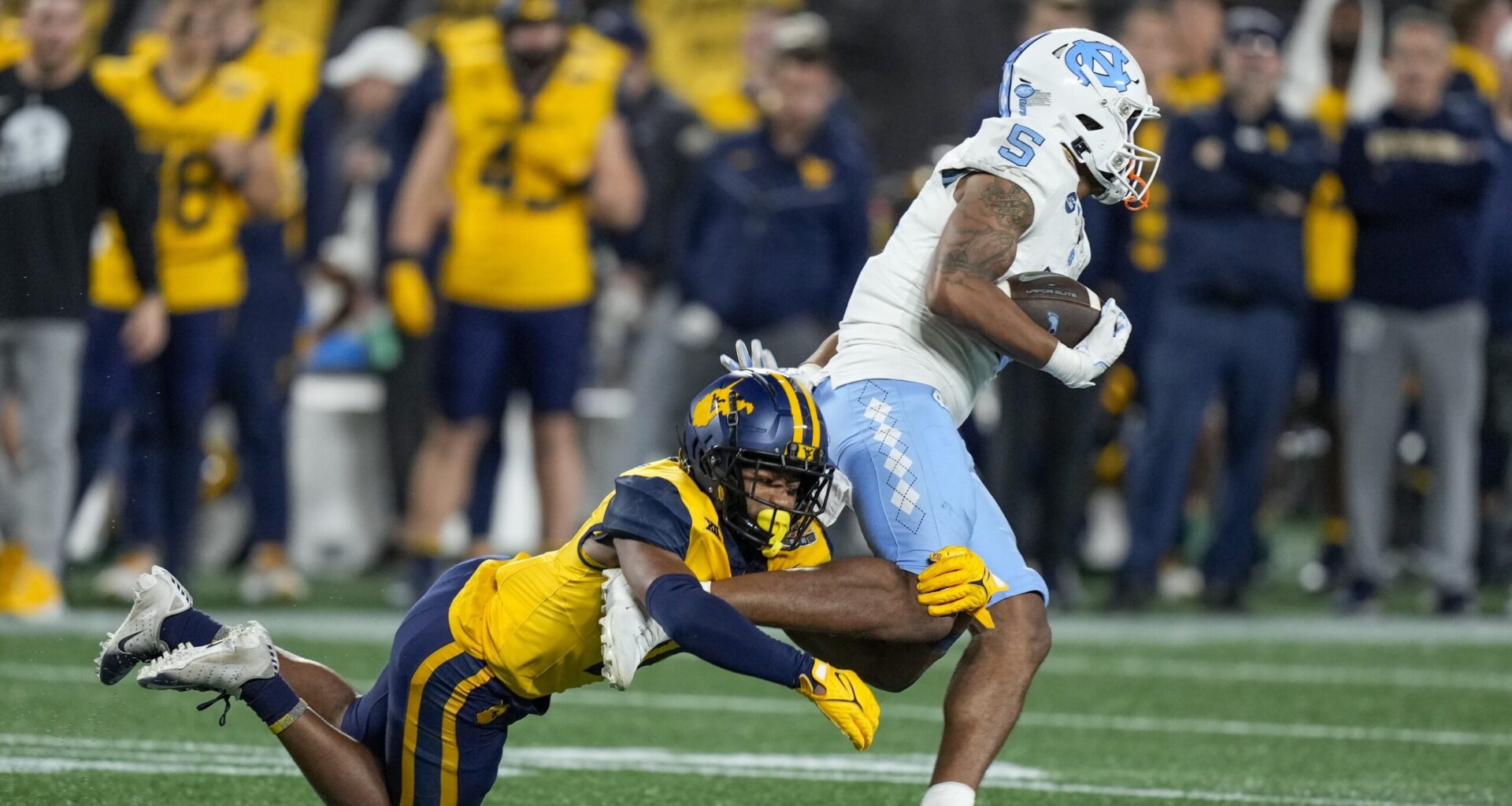 Beanie Bishop Ignites College Football Rivalry with Bold Stomp