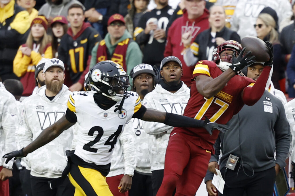 Washington Commanders wide receiver Terry McLaurin (17) catches a pass as Pittsburgh Steelers cornerback Joey Porter Jr. (24) defends at Northwest Stadium.