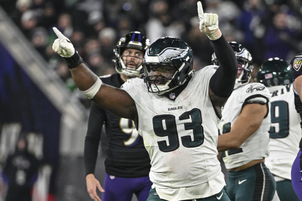 Philadelphia Eagles defensive tackle Milton Williams (93) celebrates as Baltimore Ravens place kicker Justin Tucker.