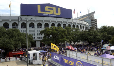 FILE - Preparations are made outside Tiger Stadium before an NCAA football game between LSU and Nor...