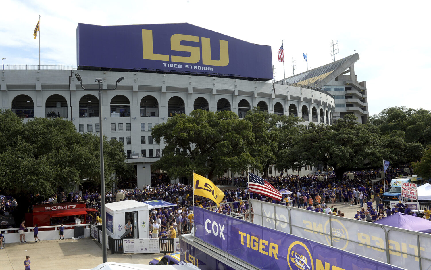 FILE - Preparations are made outside Tiger Stadium before an NCAA football game between LSU and Nor...
