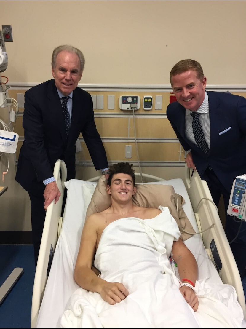 Former Cowboys Roger Staubach (left) and Jason Garrett visit Luke Laufenberg during one of...