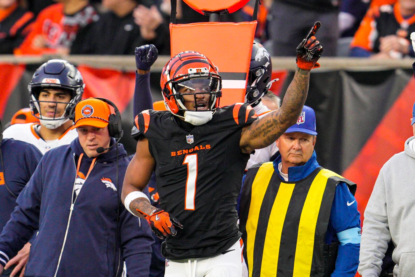 Cincinnati Bengals wide receiver Ja'Marr Chase (1) celebrates after a first down against the Denver Broncos during the first half of an NFL football game in Cincinnati, Saturday, Dec. 28, 2024. (AP Photo/Jeff Dean)