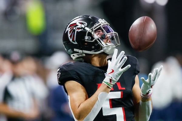 “I’ve always been overlooked — well, I wouldn’t say ‘overlooked,’ maybe ‘undermined,’ I’d say — my whole life,” Falcons wide receiver Drake London says. “It’s fine with me. It adds fuel to the fire and that’s cool." (Miguel Martinez/AJC 2024)