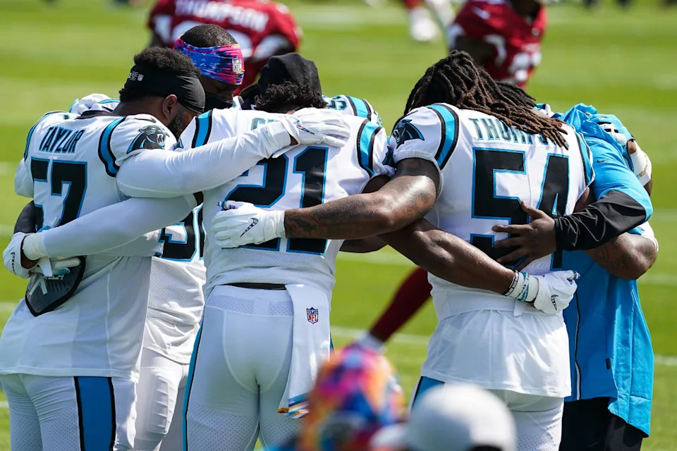 Carolina Panthers outside linebacker Adarius Taylor (57) and outside linebacker Jeremy Chinn (21) and outside linebacker Shaq Thompson (54) huddle before a game against the Carolina Panthers at Bank of America Stadium.© Jim Dedmon-Imagn Images