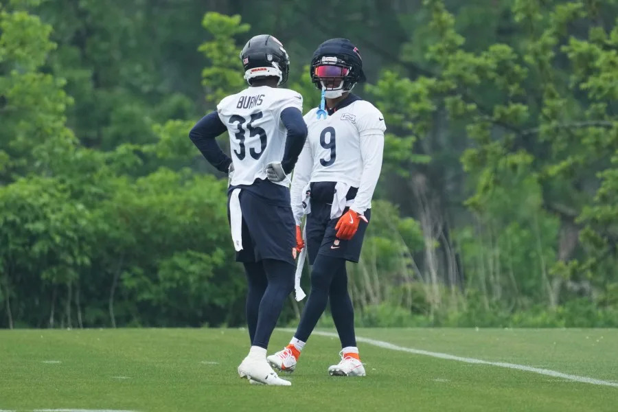 Chicago Bears defensive back Jaquan Brisker, right, talks with defensive back Major Burns during NFL football practice at Halas Hall in Lake Forest, Ill., Wednesday, June 4, 2025. (AP Photo/Nam Y. Huh)