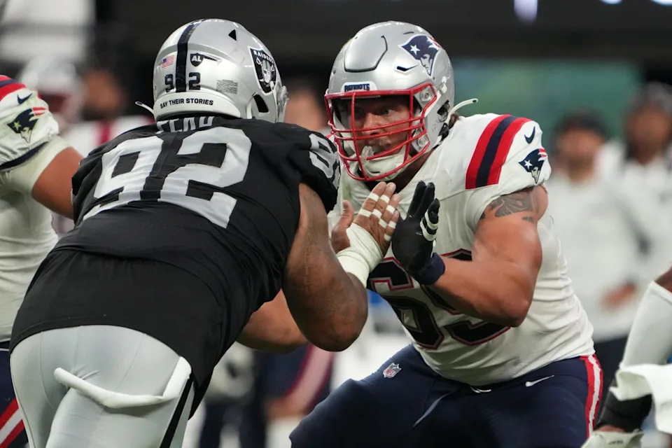 New England Patriots guard Cole Strange (69) defends against Las Vegas Raiders defensive tackle Kyle Peko (92) at Allegiant Stadium.Kirby Lee-Imagn Images