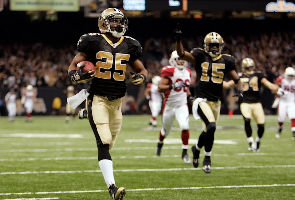 Jan 16, 2010; New Orleans, LA, USA; New Orleans Saints running back Reggie Bush (25) returns a punt for a touchdown against the Arizona Cardinals during the third quarter of the 2010 NFC divisional playoff game at the Louisiana Superdome. Mandatory Credit: Matt Stamey-USA TODAY Sports
