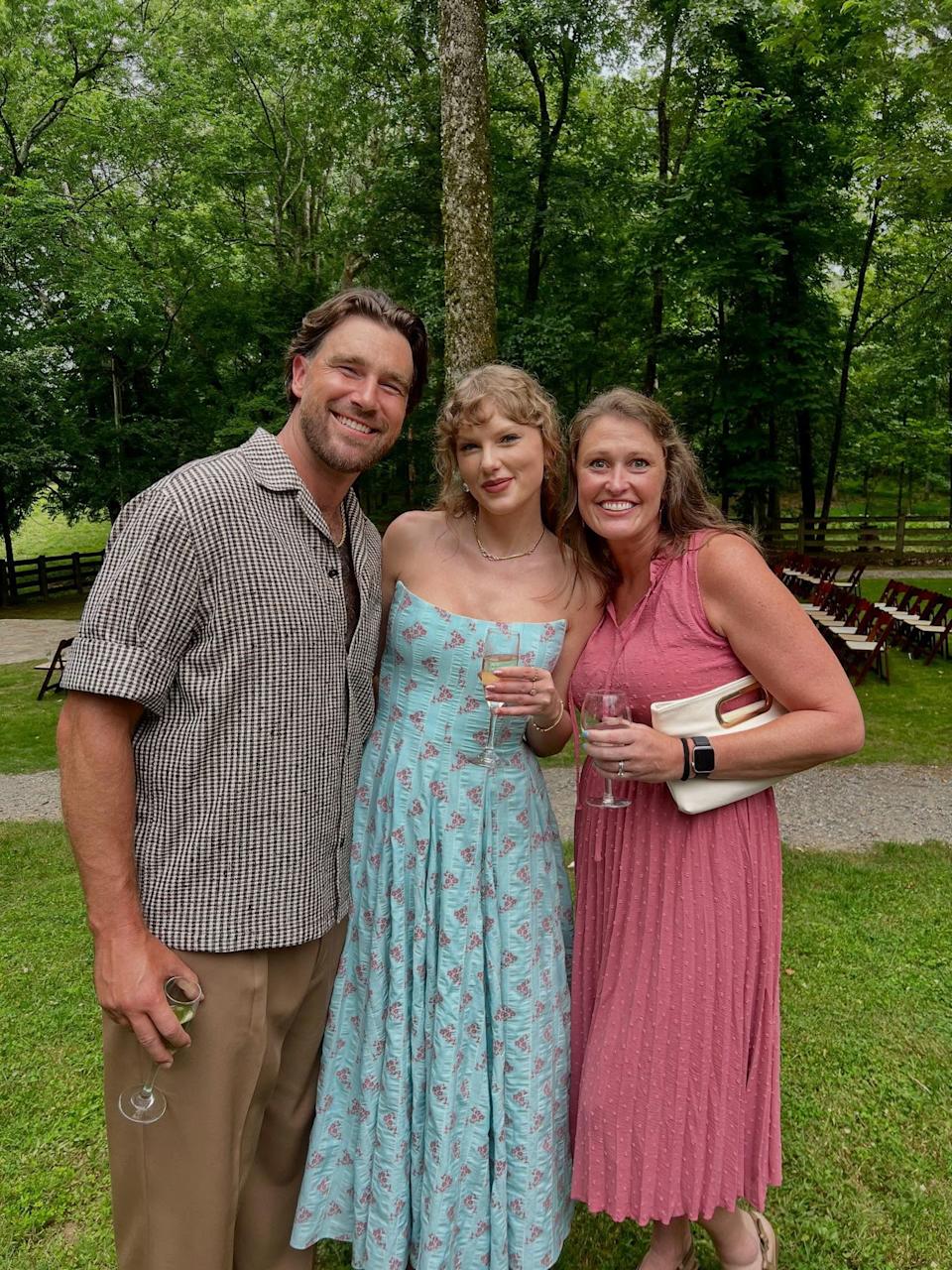 Swift wore a blue floral strapless dress from Markarian for Tanner Corum and Samantha Peck’s wedding. Instagram/@cheyrust