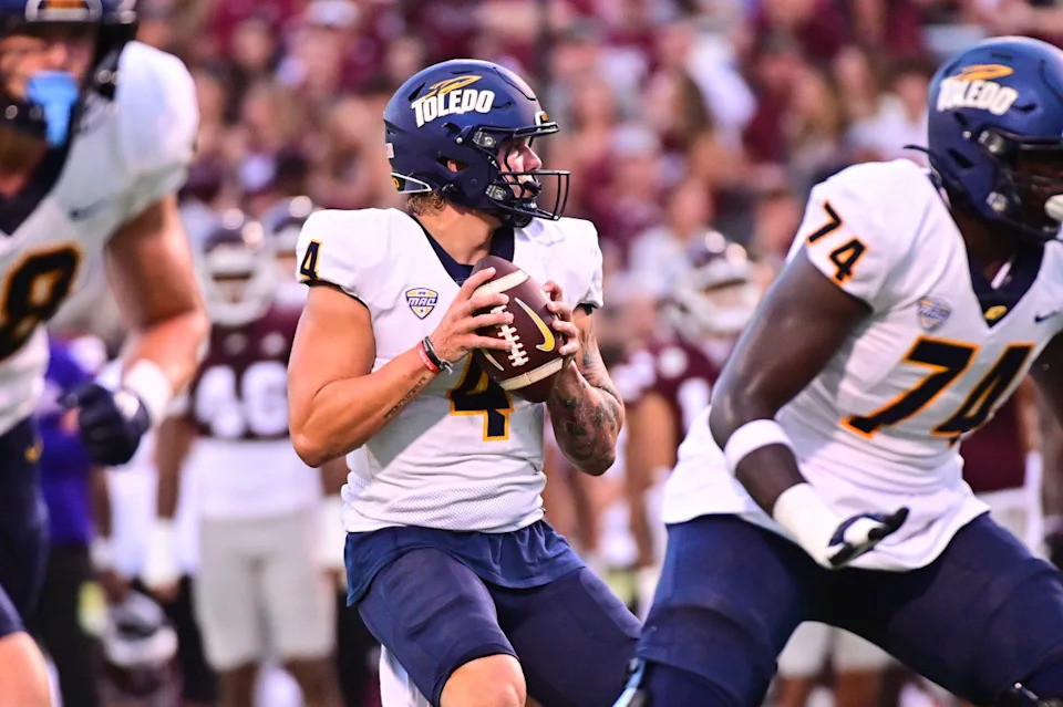Sep 14, 2024; Starkville, Mississippi, USA; Toledo Rockets quarterback Tucker Gleason (4) looks to pass against the Mississippi State Bulldogs during the first quarter at Davis Wade Stadium at Scott Field.© Matt Bush-Imagn Images