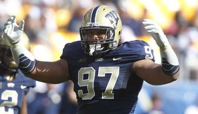 Pitt defensive lineman Aaron Donald (97) plays in an NCAA football game between Pitt and Virginia on Saturday, Sept. 28, 2013 in Pittsburgh. (AP Photo/Keith Srakocic)
