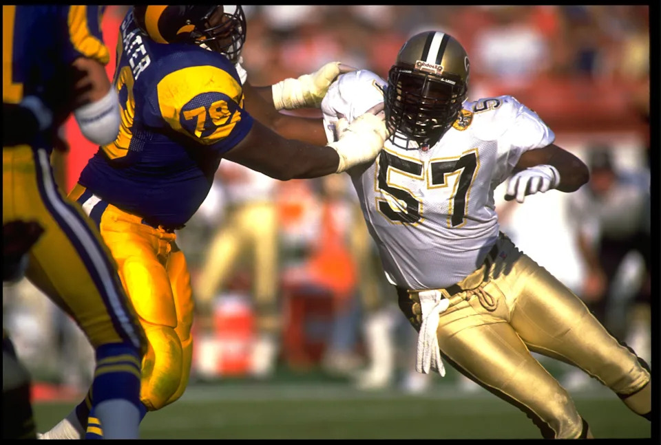 3 NOV 1991: NEW ORLEANS SAINTS LINEBACKER RICKEY JACKSON #57 TRIES TO AVOID THE BLOCK OF LOS ANGELES RAMS OFFENSIVE LINEMAN JACKIE SLATER #78 DURING THE SAINTS 24-17 WIN AT ANAHEIM STADIUM IN ANAHEIM, CALIFORNIA.
