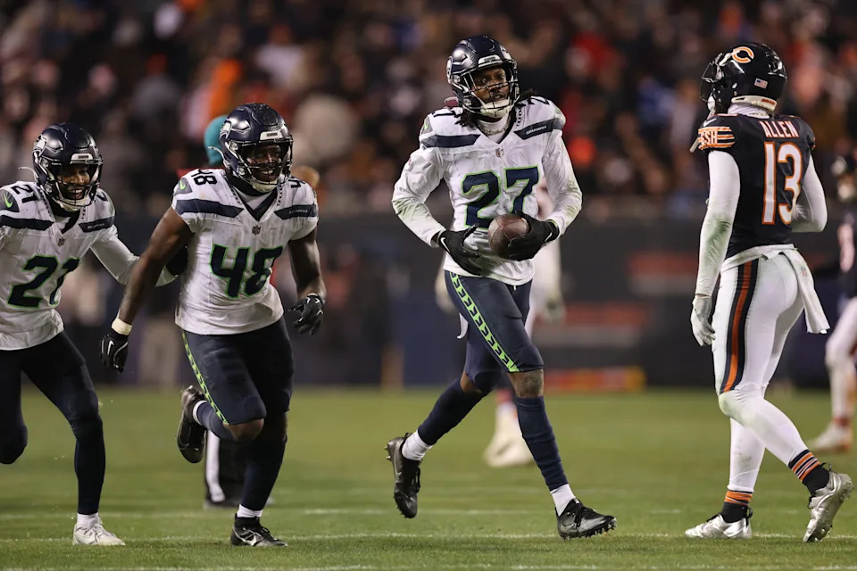 CHICAGO, ILLINOIS - DECEMBER 26: Riq Woolen #27 of the Seattle Seahawks celebrates after an interception during the fourth quarter against the Chicago Bears at Soldier Field on December 26, 2024 in Chicago, Illinois. (Photo by Michael Reaves/Getty Images)