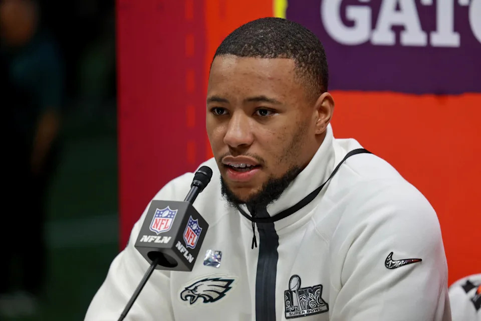 NEW ORLEANS, LOUISIANA - FEBRUARY 3: Philadelphia Eagles running back Saquon Barkley is surrounded by cameras on the field inside the Caesars Superdome during the Super Bowl Opening Night on February 3, 2025 in New Orleans, Louisiana. The Philadelphia Eagles and Kansas City Chiefs were made available for interviews during an energetic, New Orleans-themed event ahead of next Sunday's Super Bowl LIX. (Photo by Michael DeMocker/Getty Images)Michael DeMocker/Getty Images