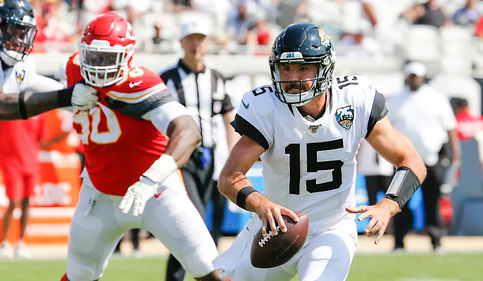 Sep 8, 2019; Jacksonville, FL, USA; Kansas City Chiefs defensive end Emmanuel Ogbah (90) chases Jacksonville Jaguars quarterback Gardner Minshew (15) out of the pocket during the second half at TIAA Bank Field. Mandatory Credit: Reinhold Matay-USA TODAY Sports