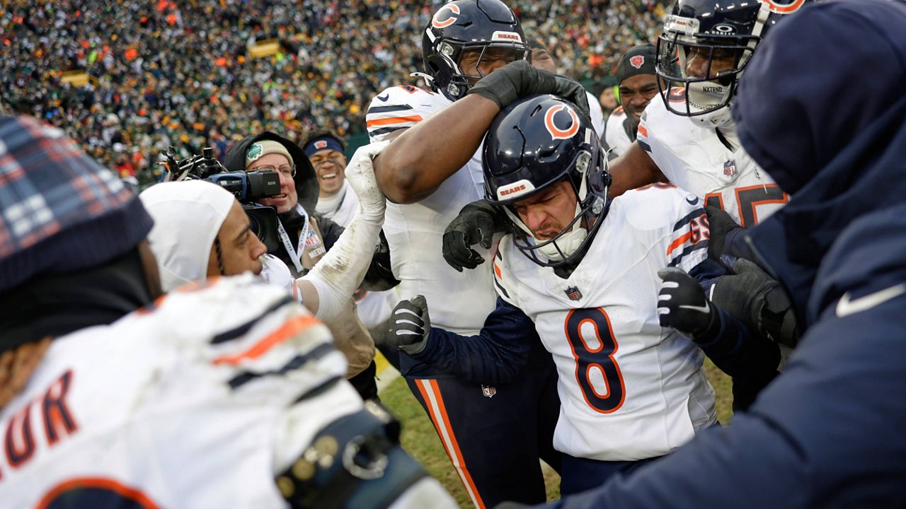 Chicago Bears' Cairo Santos is congratulated after making the game-winning field goal at the end of an NFL football game against the Green Bay Packers Sunday, Jan. 5, 2025, in Green Bay, Wis.