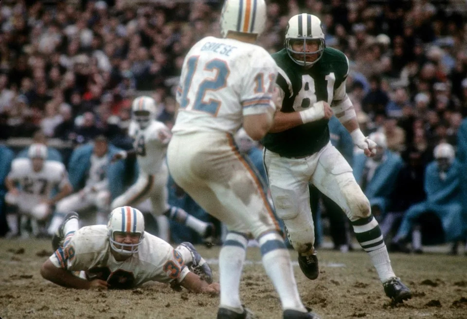 Gerry Philbin #81 of the New York Jets pursues quarterback Bob Griese #12 of the Miami Dolphins during an AFL football game at Shea Stadium October 10, 1970 in the Queens borough of New York City. Getty Images