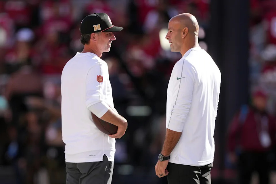 49ers head coach Kyle Shanahan and Robert Saleh talk before game.Darren Yamashita-Imagn Images