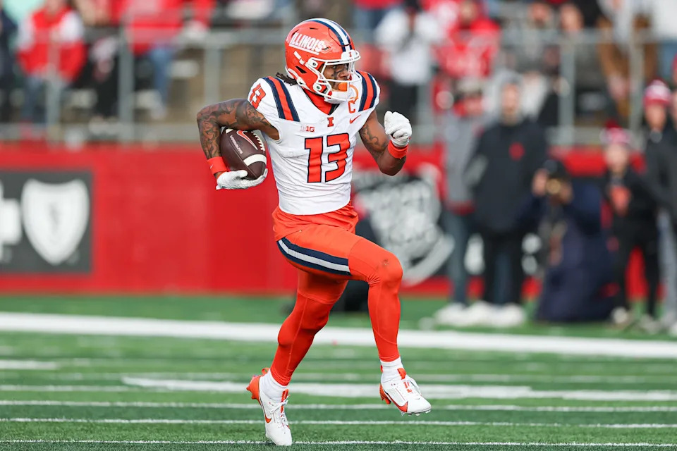 Nov 23, 2024; Piscataway, New Jersey, USA; Illinois Fighting Illini wide receiver Pat Bryant (13) gains yards after catch during the second half against the Rutgers Scarlet Knights at SHI Stadium. Mandatory Credit: Vincent Carchietta-Imagn Images