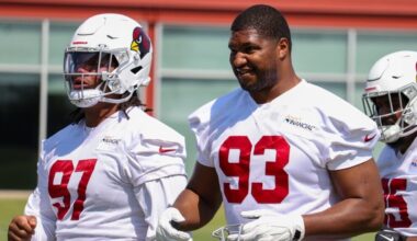 Calais Campbell and Walter Nolen III look on during Cardinals minicamp...