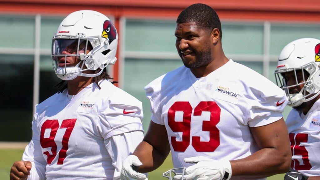 Calais Campbell and Walter Nolen III look on during Cardinals minicamp...