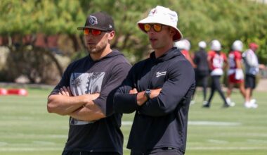 Cardinals head coach Jonathan Gannon and DC Nick Rallis look on...