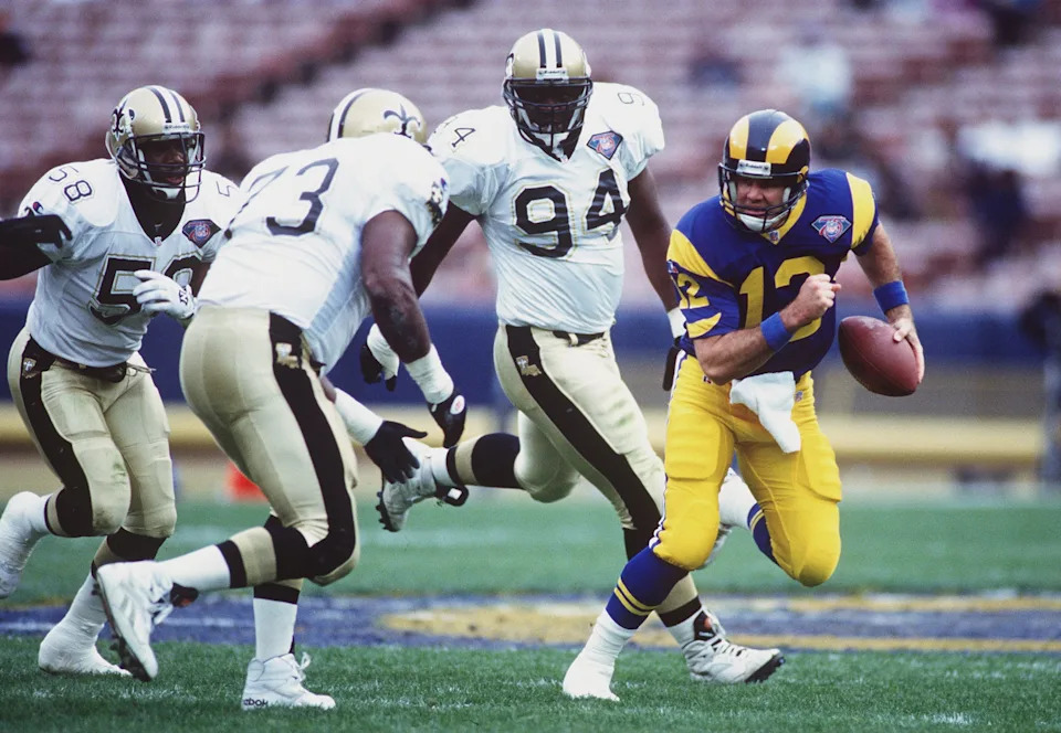 4 DEC 1994: LOS ANGELES RAMS'' QUARTERBACK CHRIS MILLER TRIRES TO EVADE THE NEW ORLEANS DEFENSE OF DARION CARTER #58, FRANK WARREN #73 AND JOE JOHNSON #94, DURING THE FIRST HALF AT ANAHEIM STADIUM IN ANAHEIM, CALIFORNIA. Mandatory Credit: Stephen Dunn/ALL