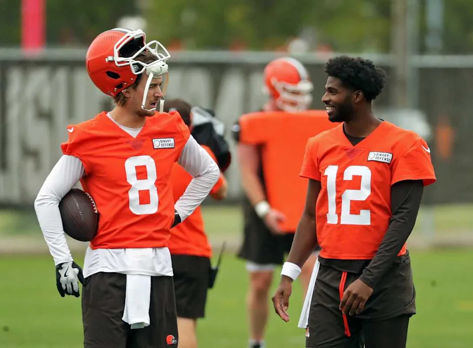 Cleveland Browns quarterback Kenny Pickett, left, chats with quarterback Shedeur Sanders (12) during an NFL practice at the Cleveland Browns training facility on Wednesday, May 28, 2025, in Berea, Ohio. © Jeff Lange / USA TODAY NETWORK via Imagn Images
