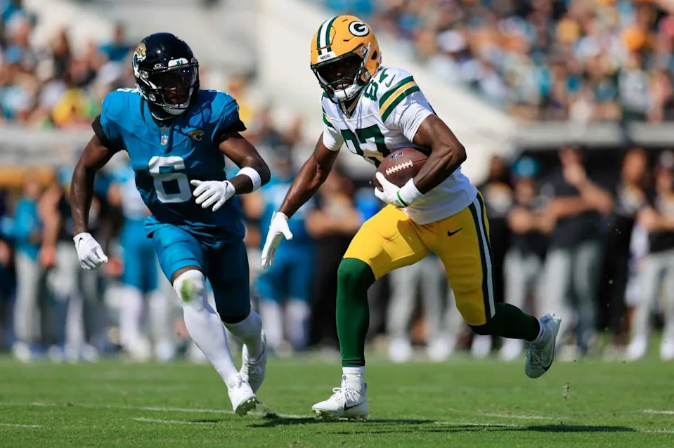 Green Bay Packers wide receiver Romeo Doubs (87) rushes for yards against Jacksonville Jaguars safety Darnell Savage (6).© Corey Perrine&sol;Florida Times-Union &sol; USA TODAY NETWORK via Imagn Images