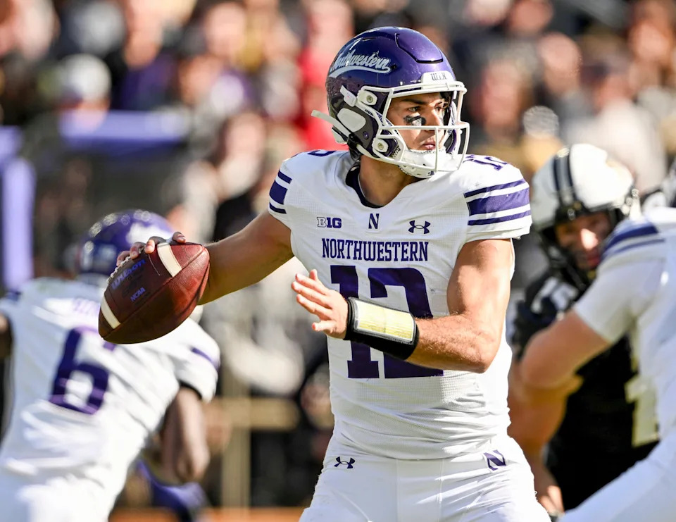 Nov 2, 2024; West Lafayette, Indiana, USA; Northwestern Wildcats quarterback Jack Lausch (12) throws a pass during the second half against the Purdue Boilermakers at Ross-Ade Stadium. Mandatory Credit: Marc Lebryk-Imagn Images
