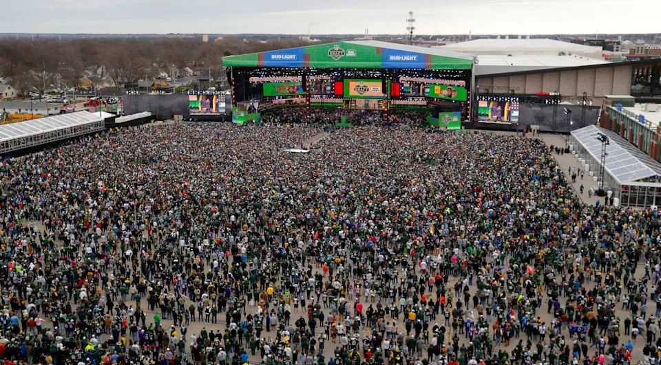 Thousands of people fill the draft theater viewing area at the start of the 2025 NFL Draft on April 24, outside Lambeau Field in Green Bay.