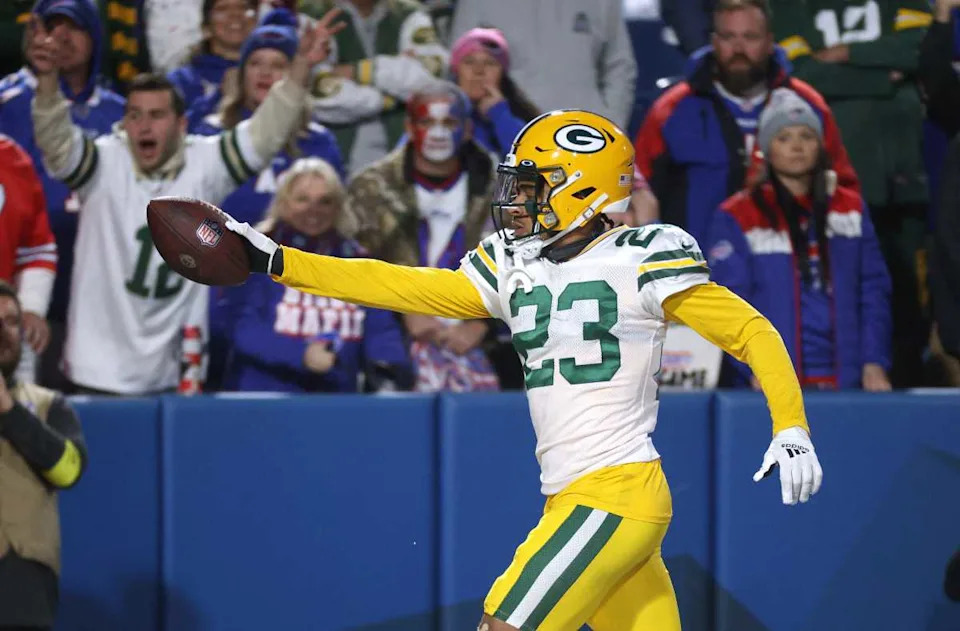 Packers cornerback Jaire Alexander gives the ball to a fan after his interception against the Bills.© JAMIE GERMANO&sol;ROCHESTER DEMOCRAT AND CHRONICLE &sol; USA TODAY NETWORK