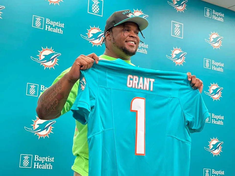 Miami Dolphins first-round pick Kenneth Grant holding up his jersey (1) at his post-draft press conference on Friday, April 25, 2025, in Miami Gardens.Hal Habib / USA TODAY NETWORK via Imagn Images