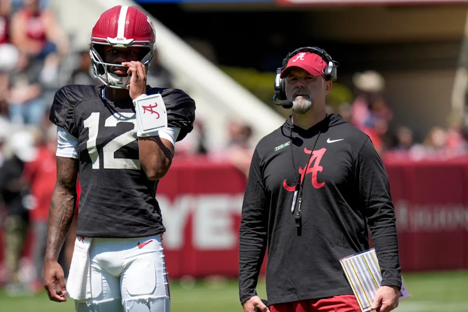 Alabama quarterback Keelon Russell (12) stands with Alabama offensive coordinator Ryan Grubb during A-Day drills at Bryant-Denny Stadium.Gary Cosby/USA TODAY NETWORK via Imagn Images