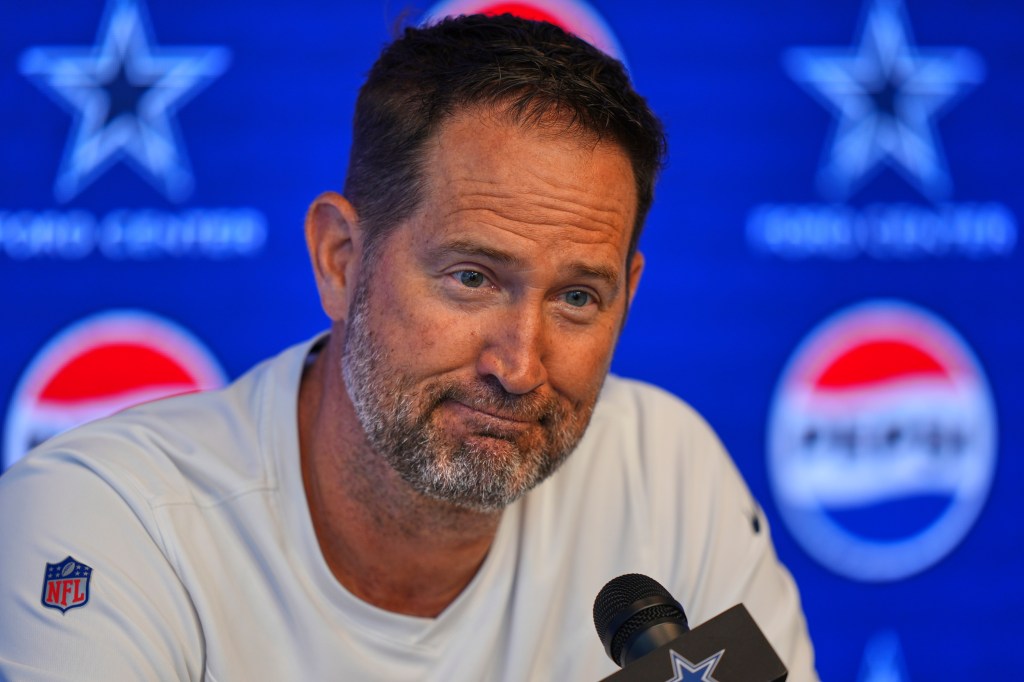 Brian Schottenheimer at a press conference.