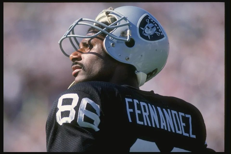 30 Sep 1990: Wide receiver Mervyn Fernandez of the Los Angeles Raiders stands on the sidelines during a game against the Chicago Bears at the Los Angeles Memorial Coliseum in Los Angeles, California. The Raiders won the game 24-10. Mandatory Credit: Mar