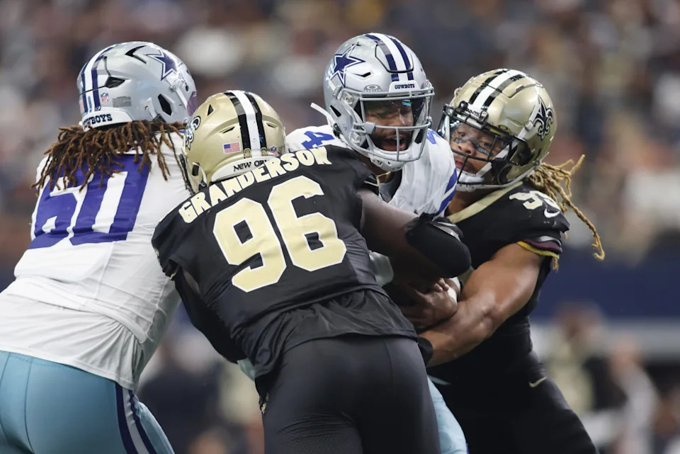 Dallas Cowboys quarterback Dak Prescott (4) is sacked by New Orleans Saints defensive end Carl Granderson (96). Mandatory Credit: Tim Heitman-Imagn Images