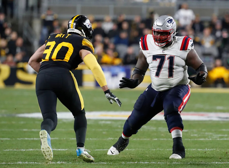 New England Patriots guard Mike Onwenu (71) blocks against Pittsburgh Steelers linebacker T.J. Watt (90) during the second quarter at Acrisure Stadium.Charles LeClaire-Imagn Images