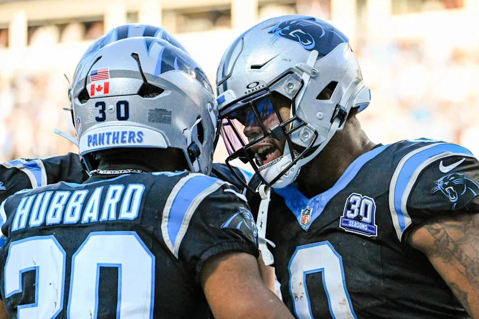Carolina Panthers running back Chuba Hubbard (30) celebrates with tight end Ja'Tavion Sanders (0) after scoring a touchdown in the fourth qarter at Bank of America Stadium.© Bob Donnan-Imagn Images