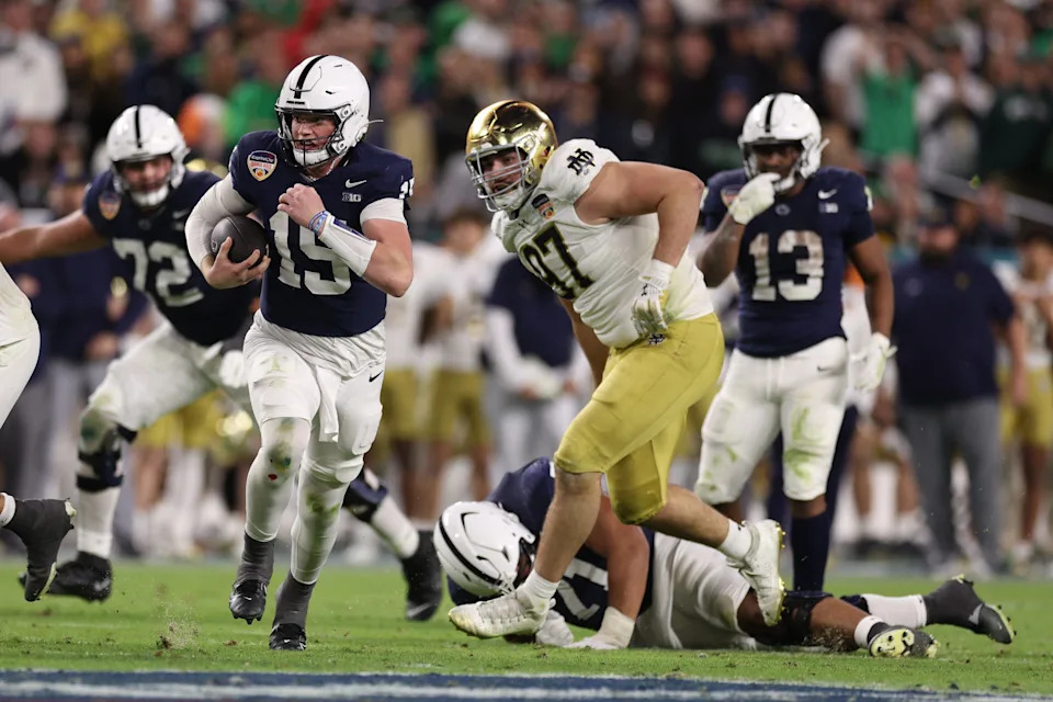 Jan 9, 2025; Miami, FL, USA; Penn State Nittany Lions quarterback Drew Allar (15) runs the ball in the second half against the Notre Dame Fighting Irish in the Orange Bowl at Hard Rock Stadium. Mandatory Credit: Nathan Ray Seebeck-Imagn Images