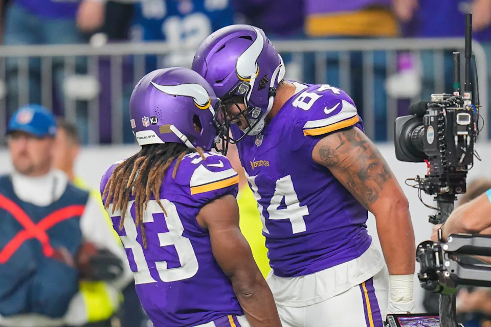 Vikings tight end Josh Oliver (84) celebrates his touchdown with running back Aaron Jones (33)Brad Rempel-Imagn Images