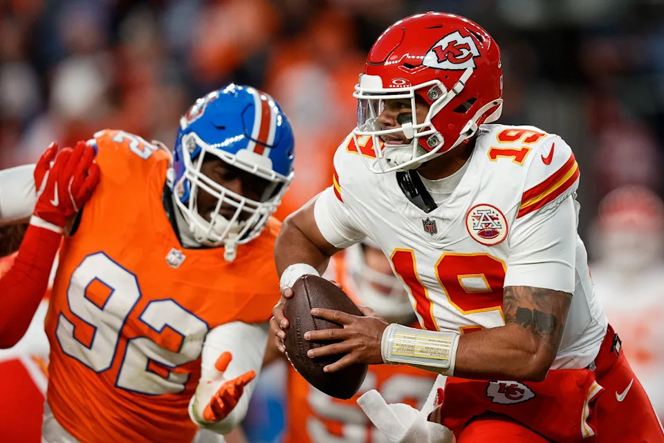 Jan 5, 2025; Denver, Colorado, USA; Kansas City Chiefs quarterback Chris Oladokun (19) scrambles under pressure from Denver Broncos linebacker Dondrea Tillman (92) in the fourth quarter at Empower Field at Mile High. Mandatory Credit: Isaiah J. Downing-Imagn Images