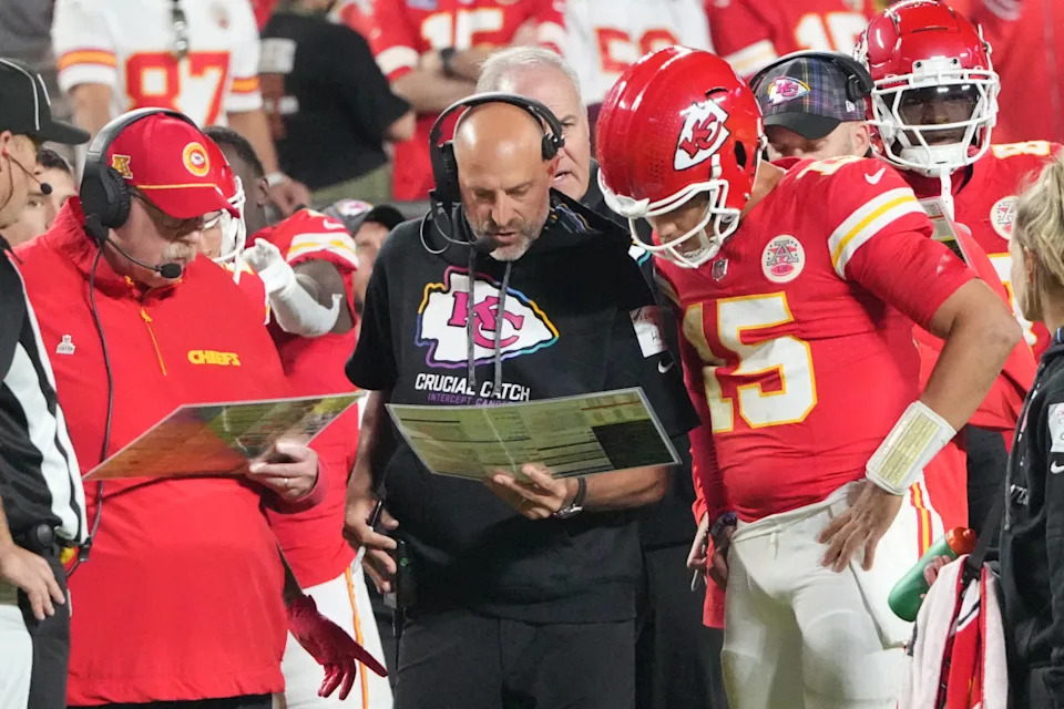 Kansas City Chiefs quarterback Patrick Mahomes (15) looks at plays with offensive coordinator Matt Nagy.Denny Medley-Imagn Image