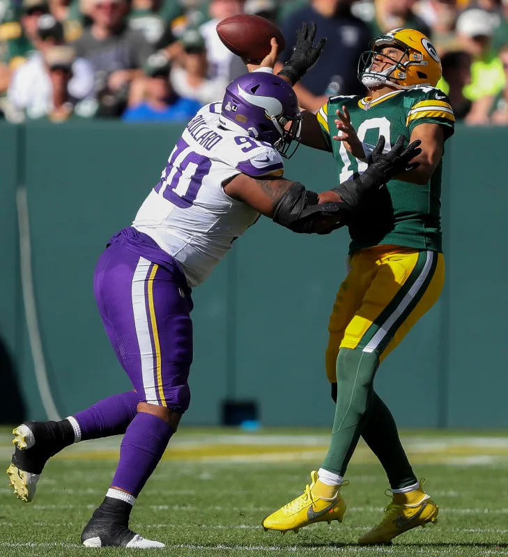 Green Bay Packers quarterback Jordan Love (10) throws under pressure from Minnesota Vikings defensive end Jonathan Bullard (90). Mandatory Credit: Tork Mason/USA TODAY Network via Imagn Images