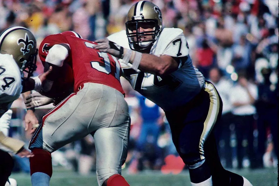New Orleans Saints defensive lineman Derland Moore (74) tackles a runner against the Atlanta Falcons. Credit: Crescent City Sports