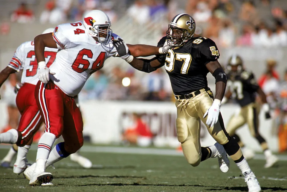 TEMPE, AZ - OCTOBER 18: Defensive end Renaldo Turnbull #97 of the New Orleans Saints moves against Rick Cunningham #64 of the Phoenix Cardinals at Sun Devil Stadium on October 18, 1992 in Tempe, Arizona. The Saints defeatd the Cardinals 30-21. (Photo by Stephen Dunn/Getty Images)