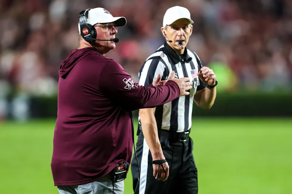 Texas A&M football head coach Mike Elko calls a timeout.Jeff Blake-Imagn Images