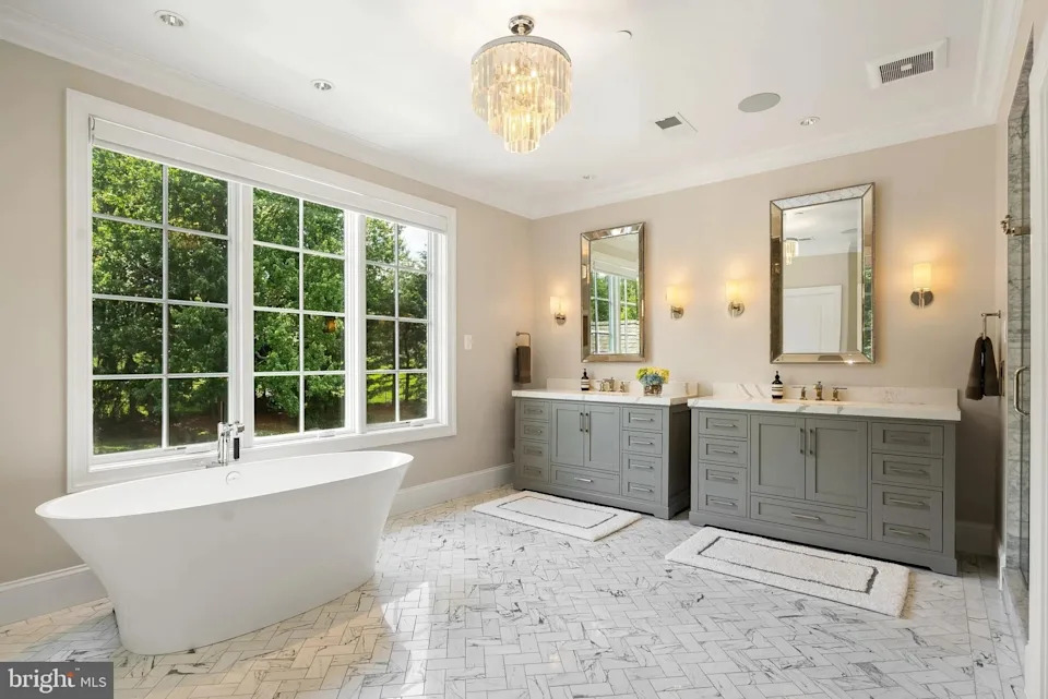 The primary bathroom features a large soaking tub and two marble vanities.<p class="credit">(Realtor.com)</p>